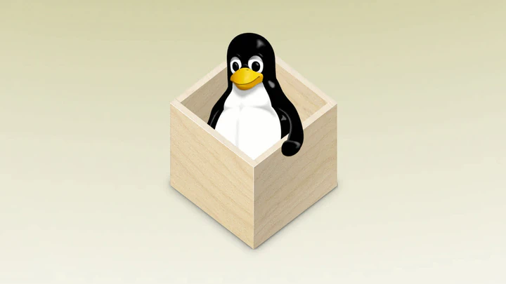 Tux sits smiling inside the flatpak logo, an isometric wooden box.